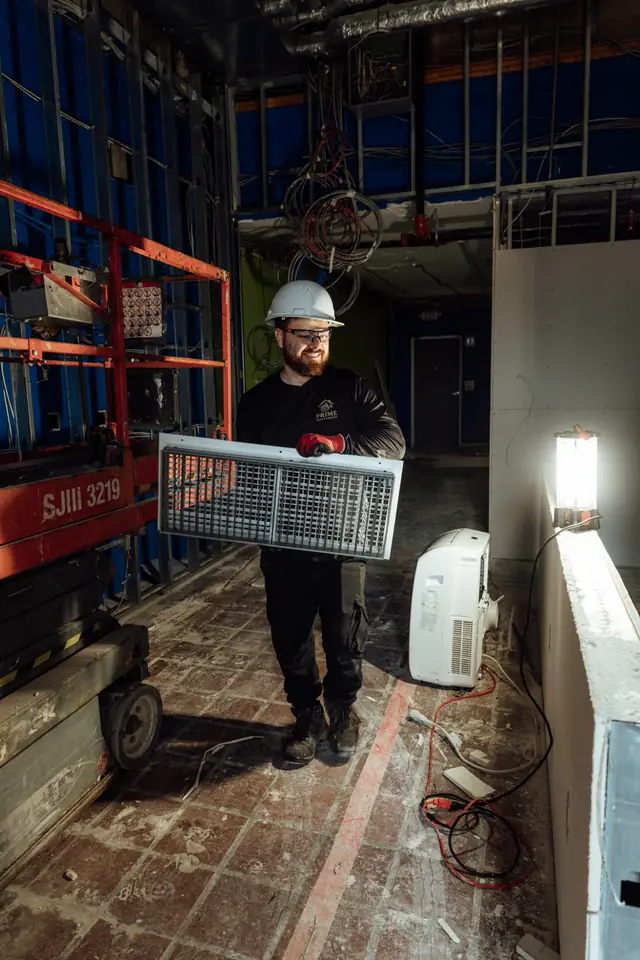 Technician working from a lift indoors
