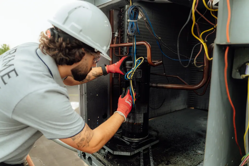 Copper refrigerant lines and a compressor inside an HVAC unit