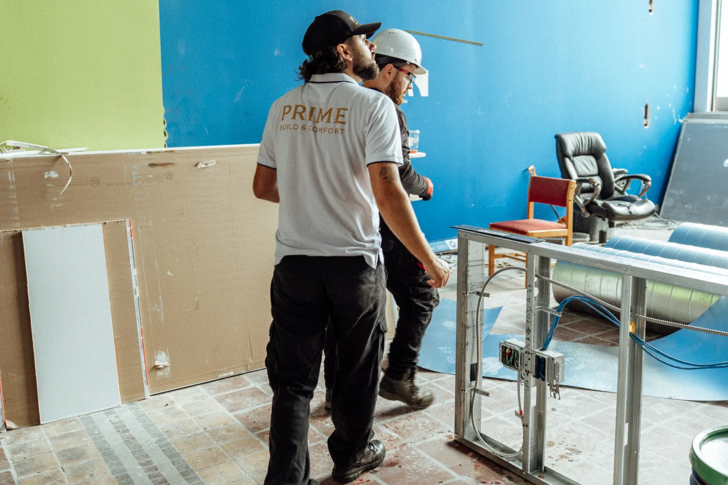A Prime crew on a job site, walking through a commercial space mid-renovation