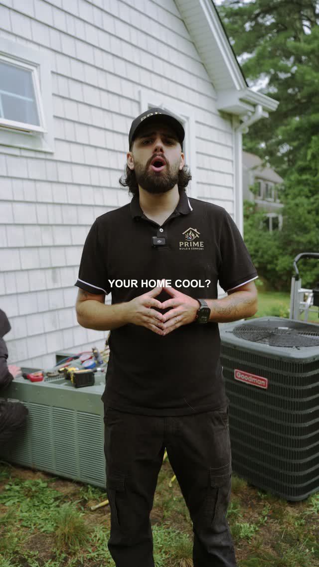 Prime technician talking through a home cooling check beside an outdoor AC unit